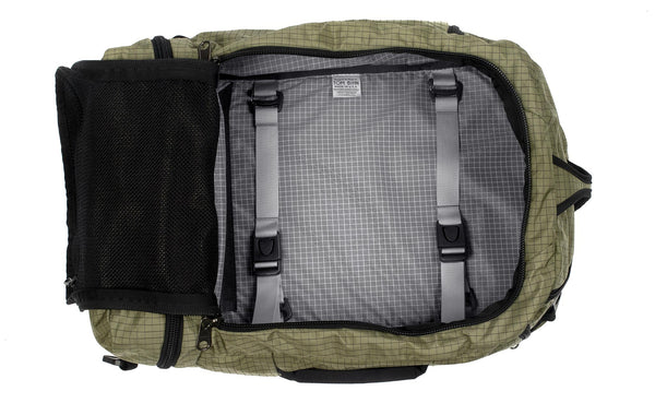 An open Techonaut 30 with a Taiga (sage green) Halcyon exterior and a Northwest Sky (grey) interior.